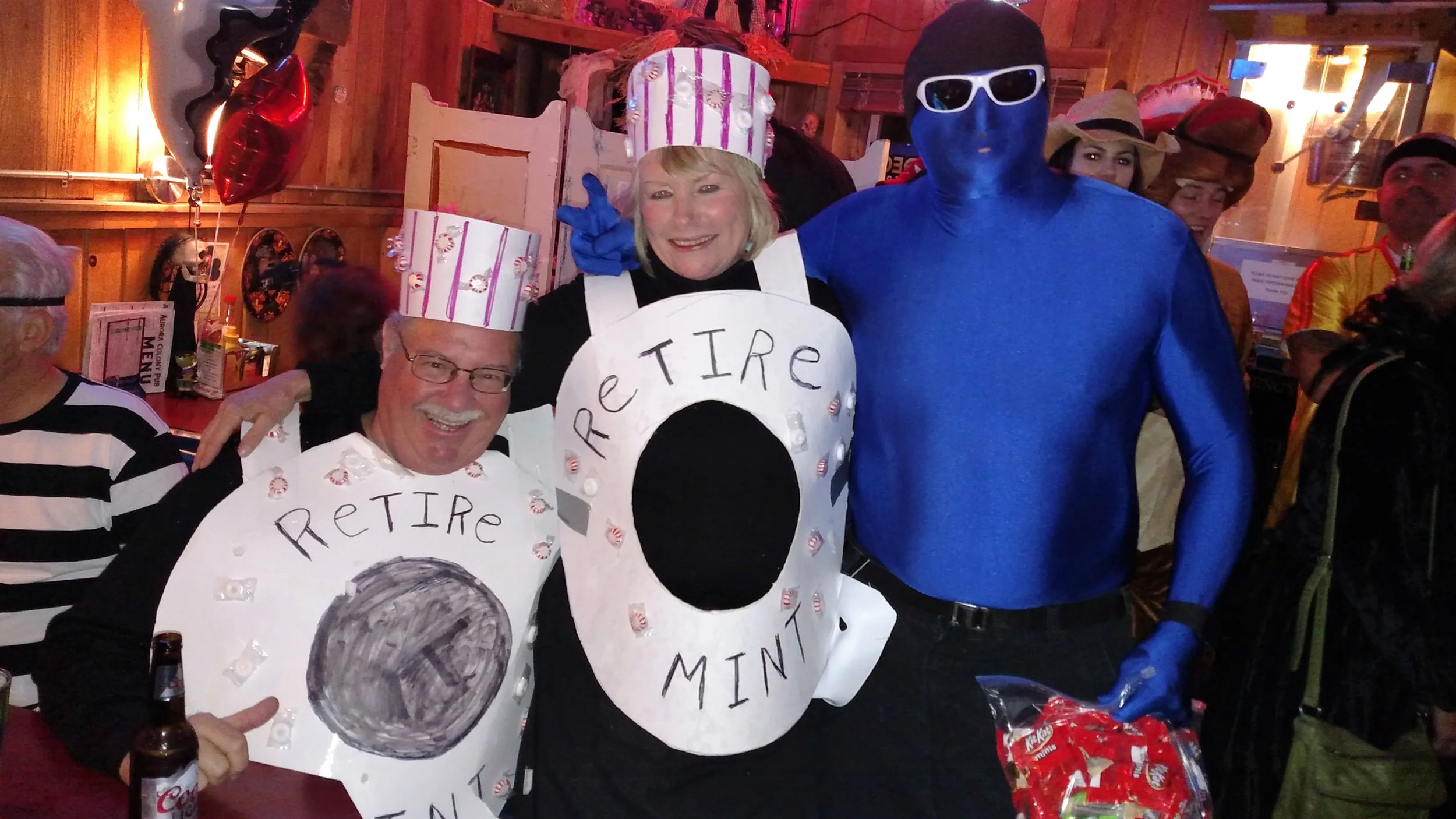 Costume-party regulars dressed up — bodysuits, props and big grins for the camera.